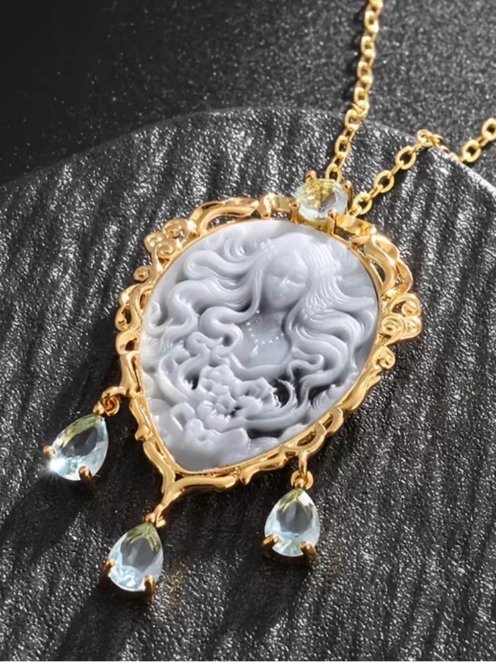 Gold Cameo Pendant Necklace with Gray Cameo and Light Blue Gem Drops